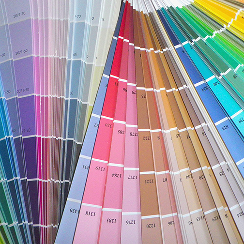 A deck of paint color sample cards.